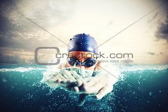 Athlete swims in a blue deep water