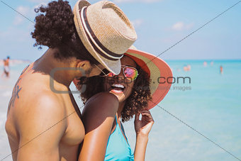 Happy laughing romantic couple at seaside