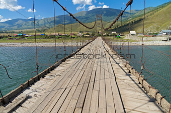 Old suspension bridge. Altai,  Russia.