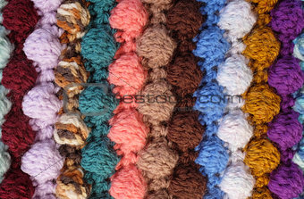 Vertical bobble crochet stitches, multi-coloured wool striped ba