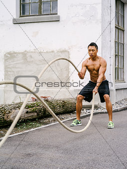 Workout outdoors with training ropes