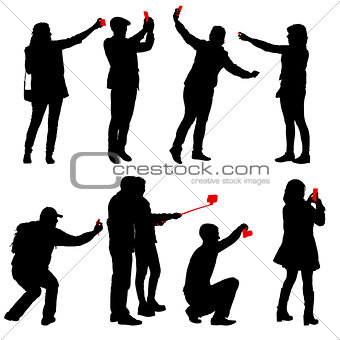 Set silhouettes man and woman taking selfie with smartphone on white background