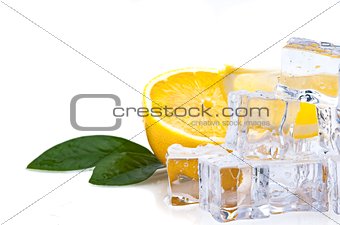 Half of a fresh, bright juicy lemon with green leaves and cubes of cold ice, on a white background.