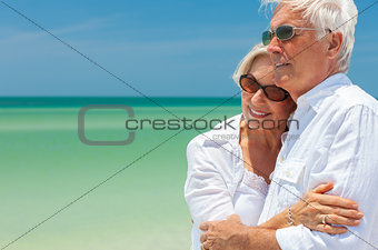 Happy Senior Couple Dancing Embracing on a Tropical Beach