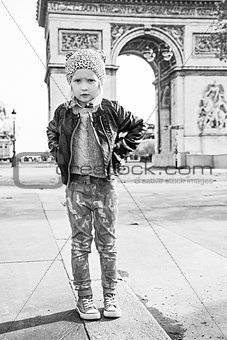 Full length portrait of elegant child near Arc de Triomphe