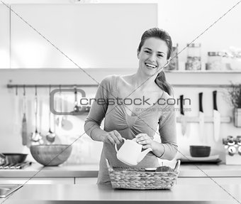 Smiling young housewife serving breakfast tray