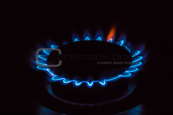 A gas burner with blue burning gas
