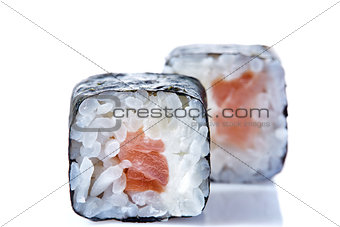 Traditional fresh japanese sushi rolls on a white background, close-up, selective focus.