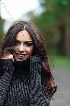 Outdoor portrait of young pretty beautiful calm woman