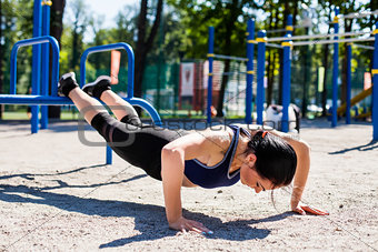 young sportive trainer on sport playground