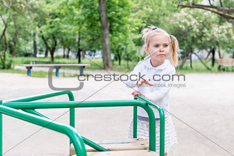 Child is riding a carousel
