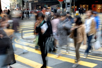 blurred people crossing street