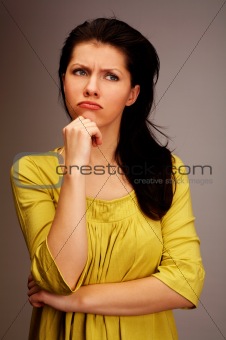 pensive woman over grey
