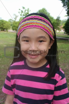 Smiling girl with hair-band