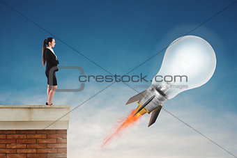 Fast lightbulb as a rocket ready to fly fast. Concept of new super idea