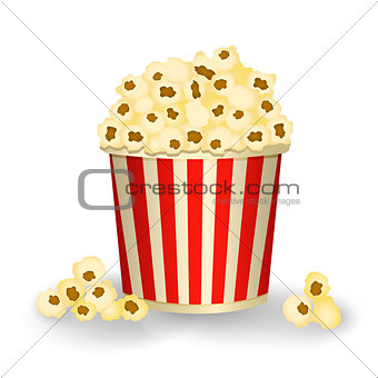 Red white bucket with popcorn isolated on white background.