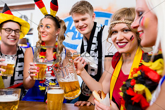 Football fans watching a game of the German national team