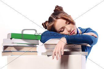 Girl fell asleep for books isolated on white