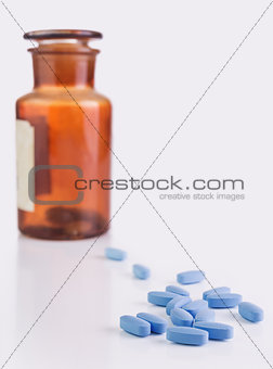 Blue pills on white