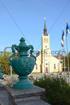 Green urn in front of St John's Church, Tallinn, Estonia