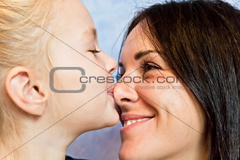 Blond daughter with brunette mother