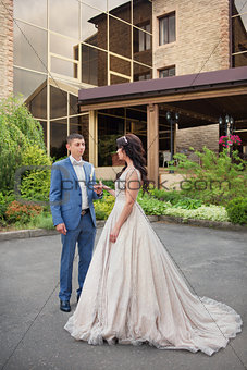 beautiful happy young bride and groom celebrating wedding outdoor