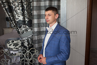young beautiful caucasian groom man indoor celebrating wedding