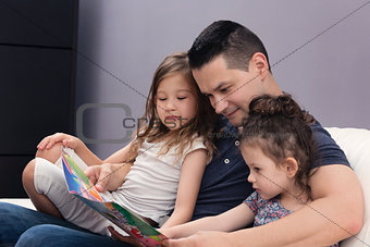 Father Reading His Daughters Stories 