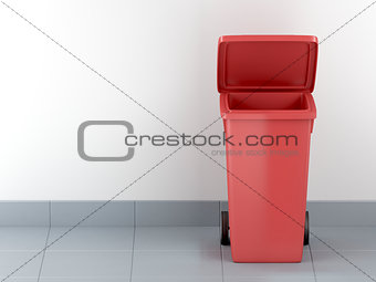 Red plastic waste container