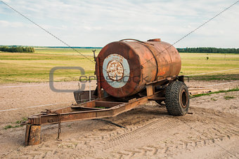 Barrel trailer with water on the field