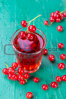 Redcurrant and glass of fruit drink juice