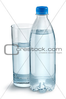 Glass with water and a plastic bottle
