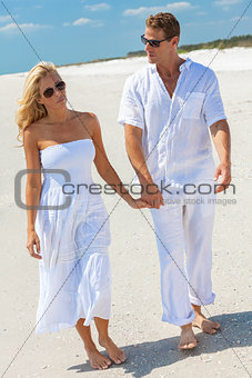 Sad Young Man Woman Couple Walking on A Beach