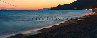 Sunset on sea beach, panorama.