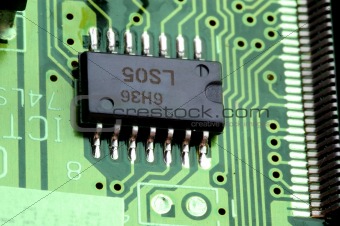 close-up chip on green motherboard 