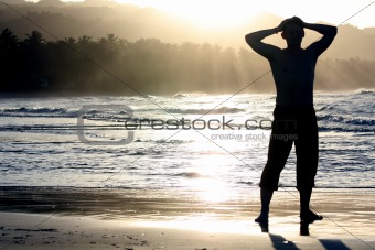 silhouette of man on the beach