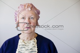 Senior woman with a vintage hat