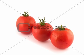 Three red tomatos