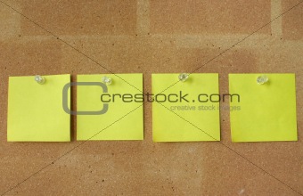yellow notes pinned in line