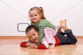 Happy brother and sister playing
