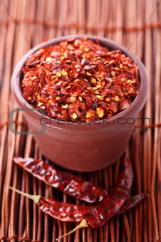Hot Red Chilli Chillies crushed pepper in teracotta pot