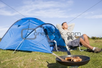 Man relaxing on camping trip