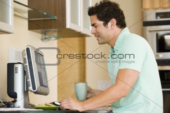 Hispanic man using home computer
