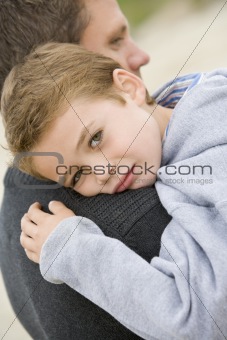 Son giving Father cuddle