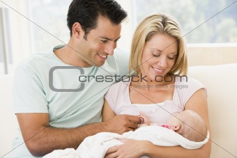 Couple with new baby at home