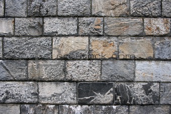 Old grunge stone wall ,close up photo