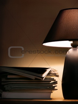 Magazines under evening lamp light