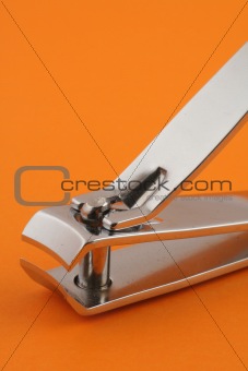 nail clippers on orange