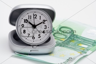 Clock and money (euros)