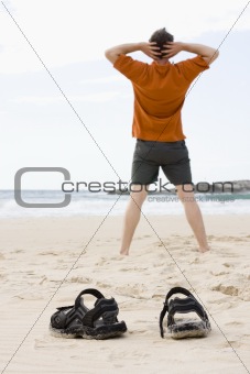 Man doing exercises on beach